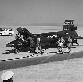 Ground personnel gather around Joe Walker in X-15 no. 3 soon after the landing of the fifth astronaut qualification flight in the X-15 program. 